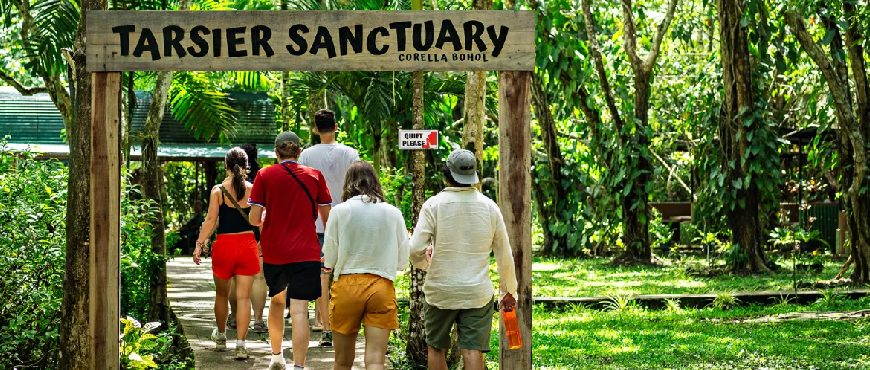 Visitors entering Tarsier Sanctuary in Corella, Bohol as part of a Bohol tour package