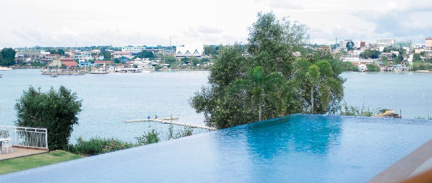 Infinity pool at Casa Filomena Resort in Dauis, Bohol overlooking the Tagbilaran Strait and waterfront town