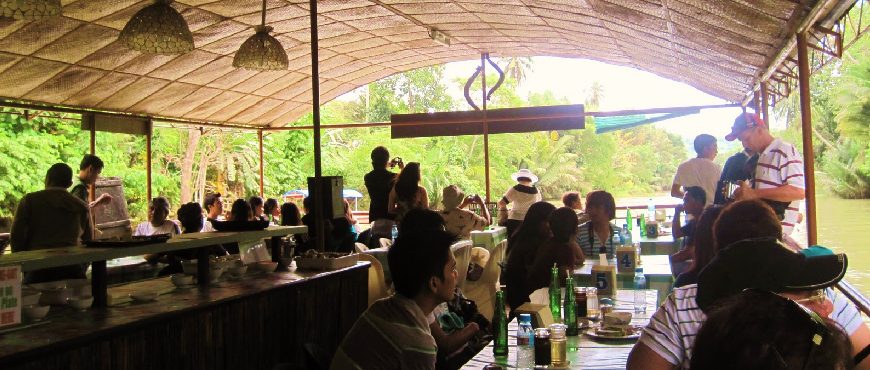Bohol Loboc River cruise floating restaurant tour with buffet lunch and scenic jungle views.