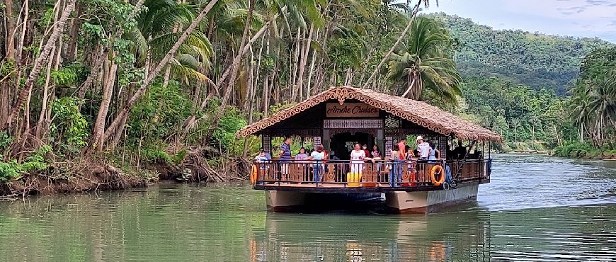Scenic Loboc River floating restaurant cruise in Bohol, Philippines.
